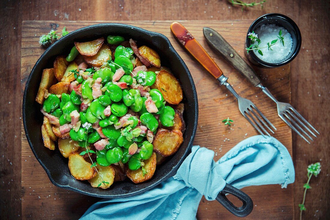 Fresh fava beans fried with new potatoes, pancetta and thyme