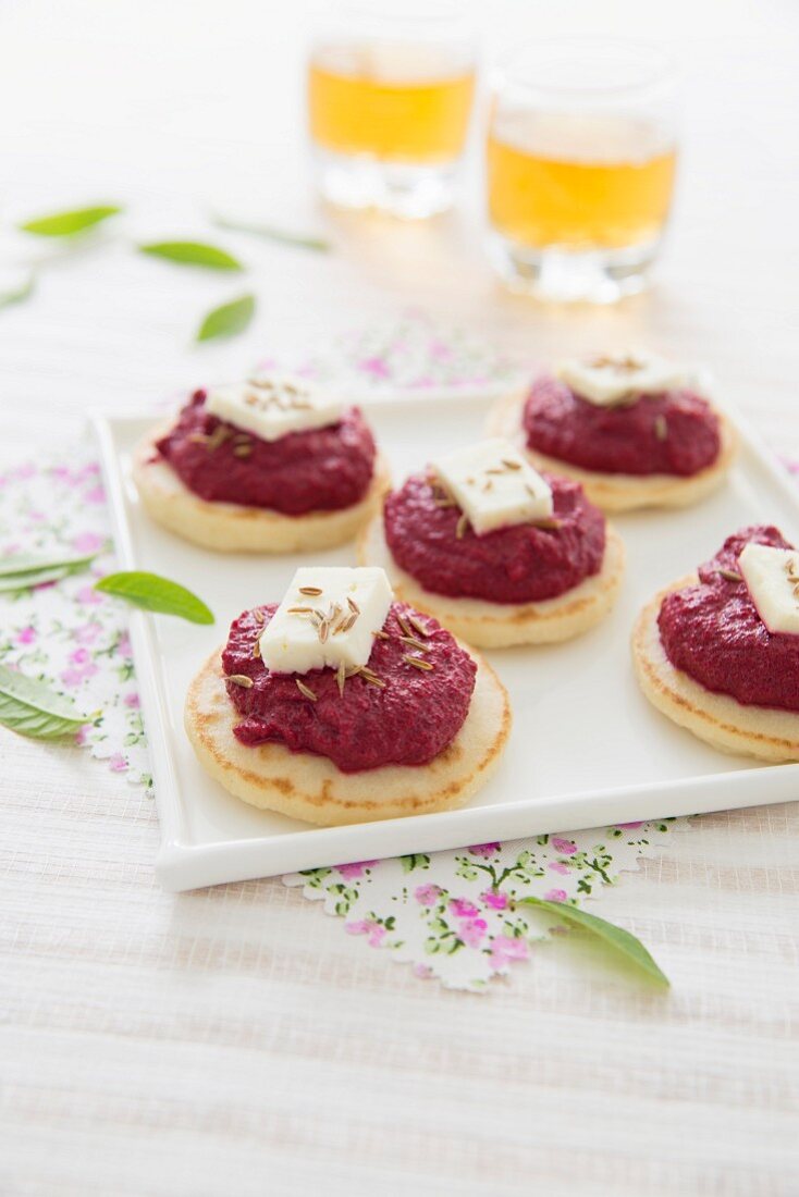 Creamed beetroot and goat's cheese blinis