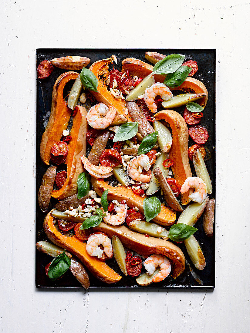 Baked butternut squash,potatoes,tomatoes,shrimps,chili pepper,basil and hazelnuts