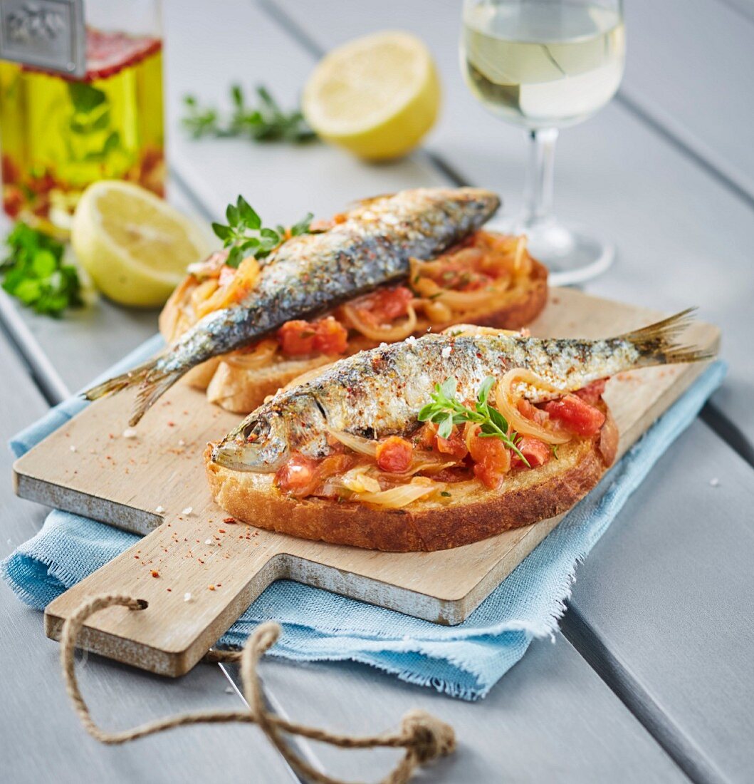 Grilled Sardines With Salt,Spices And White Wine,Stewed Onions And Tomatoes On Toast