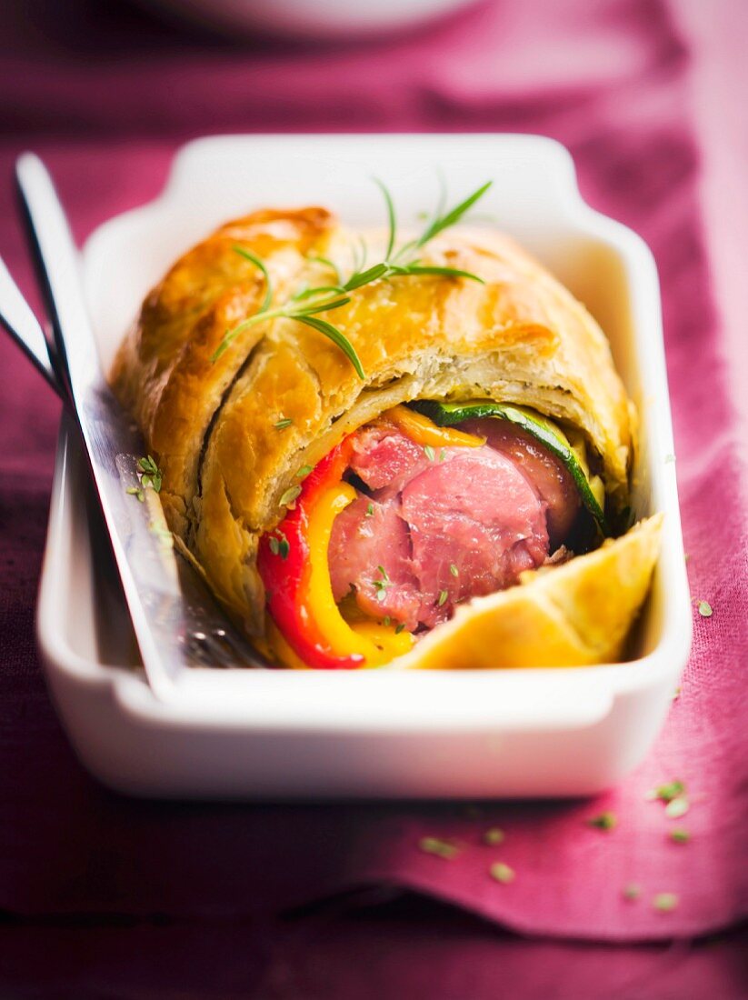 Knuckle of pork in pastry crust with southern vegetables and rosemary