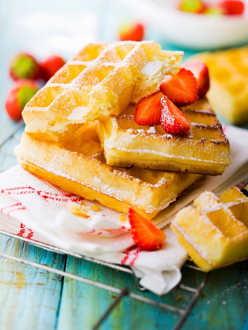 Brussels waffles with icing sugar and strawberries