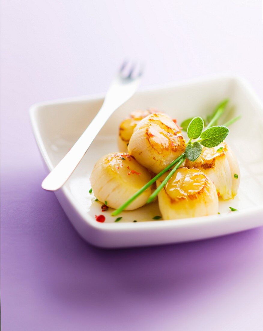 Roasted scallops with fresh herb and pink pepper butter