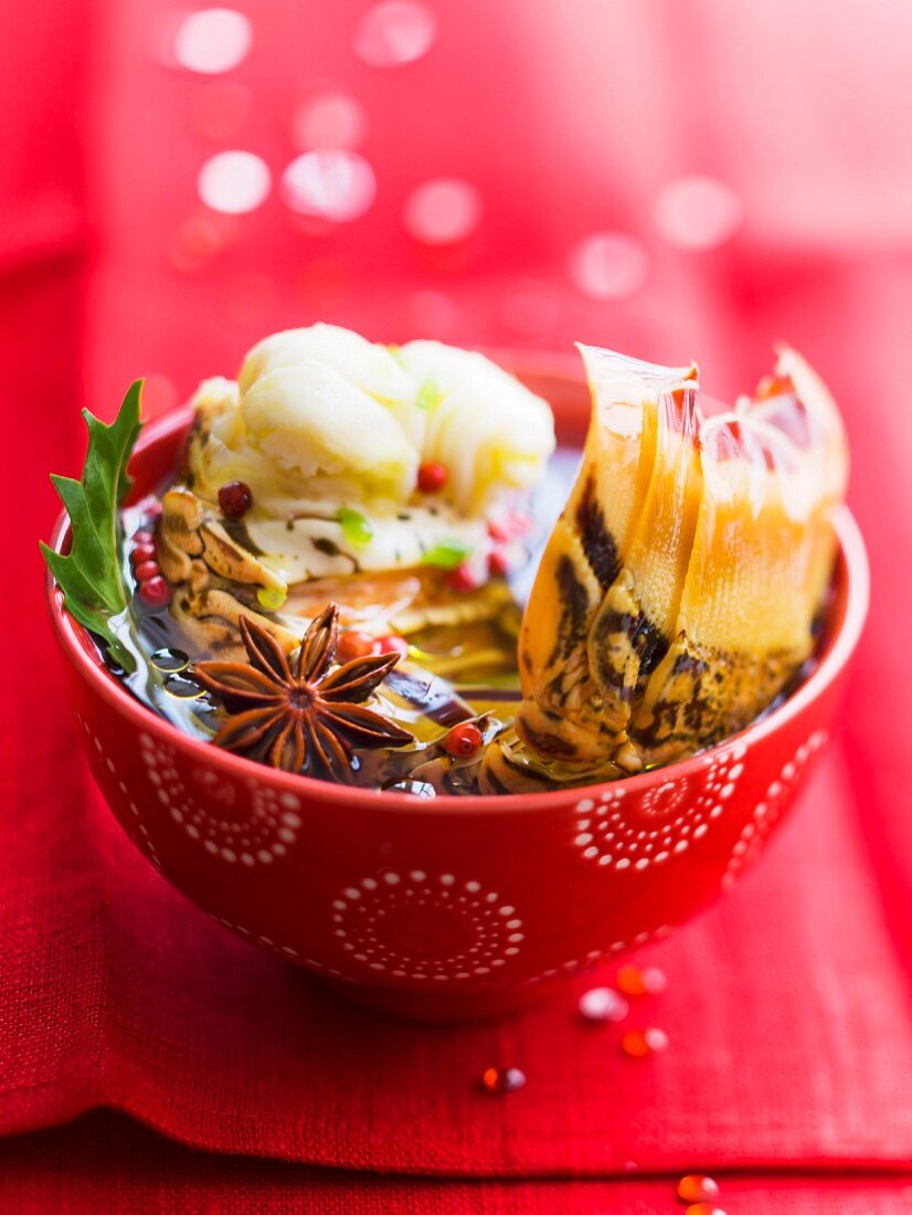 Spiny lobster tails in a spicy broth