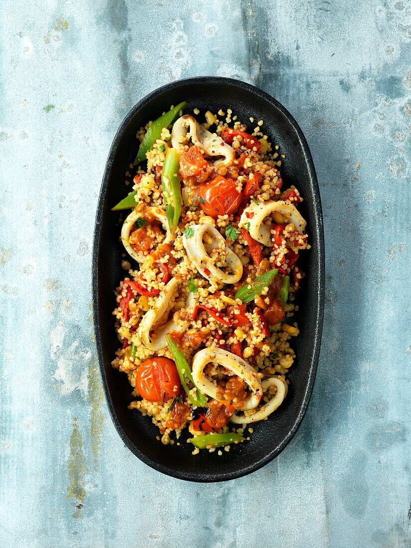 Quinoa salad with squid, cherry tomatoes and beans