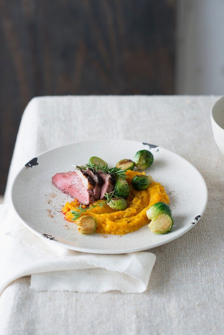Magret de canard with rosemary, pumpkin mash with Brussels sprouts