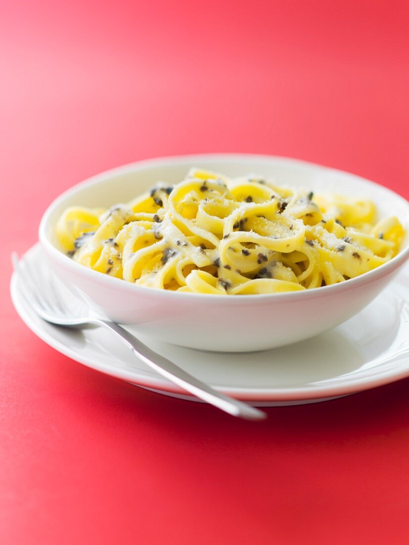 Tagliatelles with white summer truffles, button mushrooms and parmesan