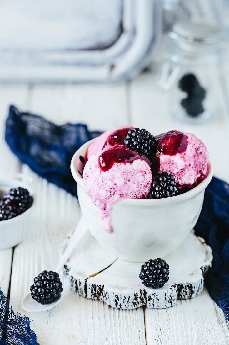 Bowl of ice cream and blackberry coulis