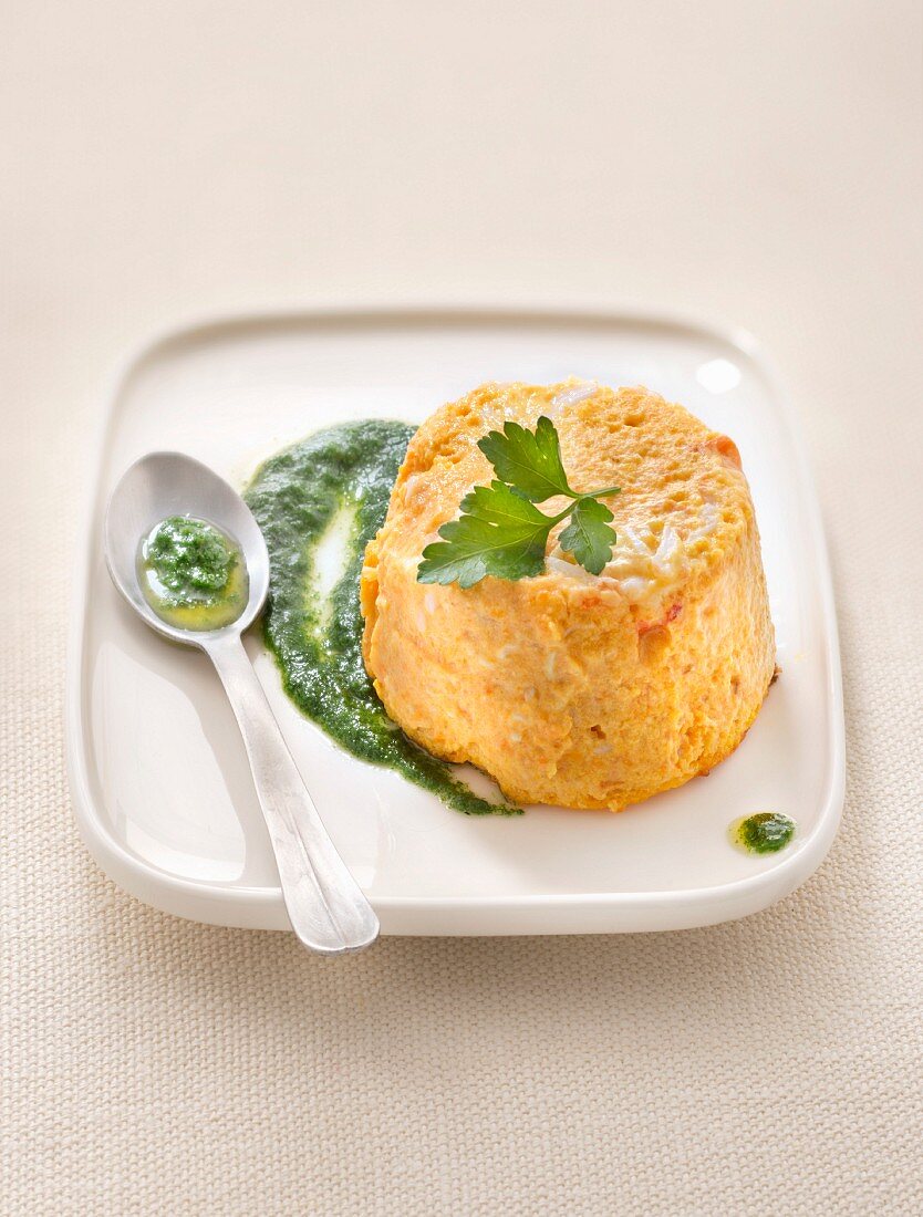 Carrot and crab mousse flan, parsley sauce