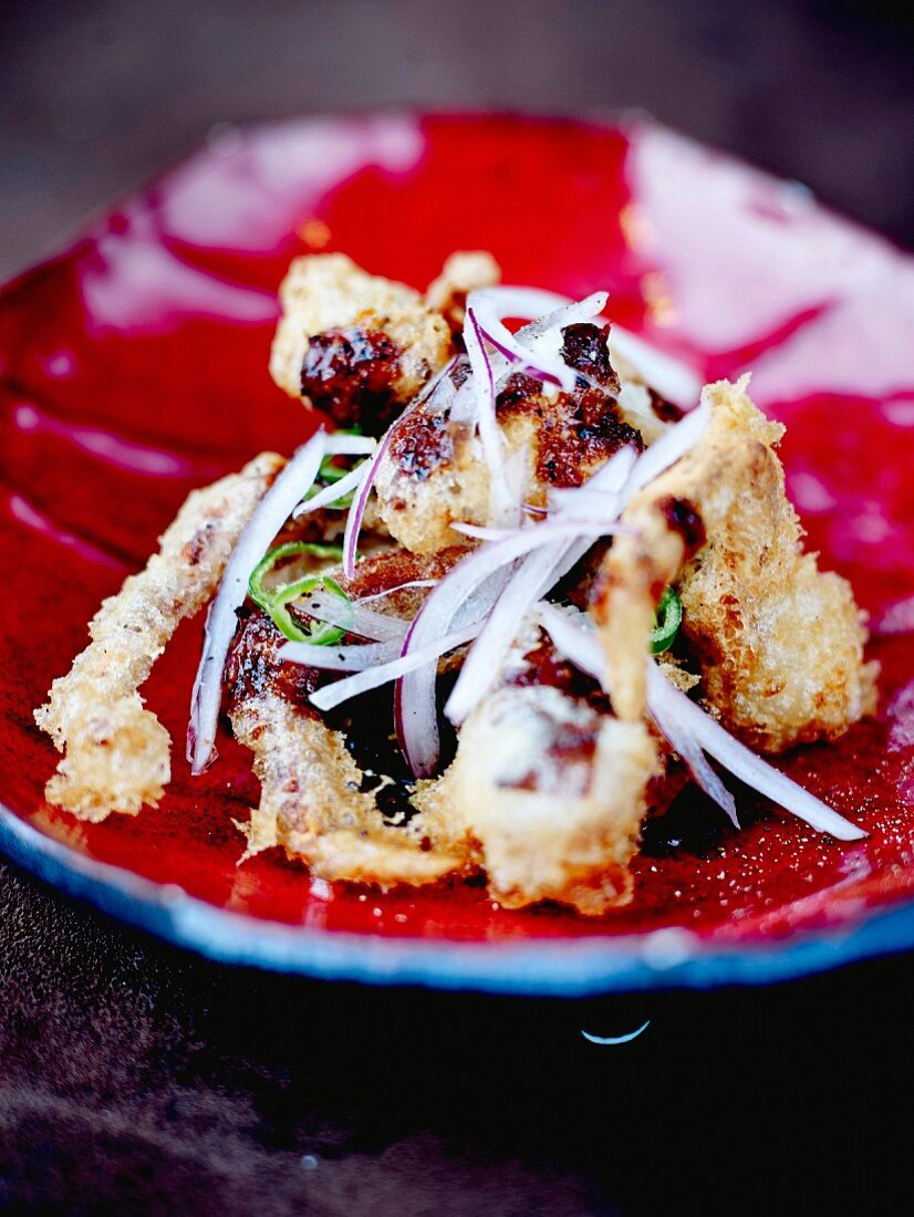 Spicy and crispy octopus fritters with red onions
