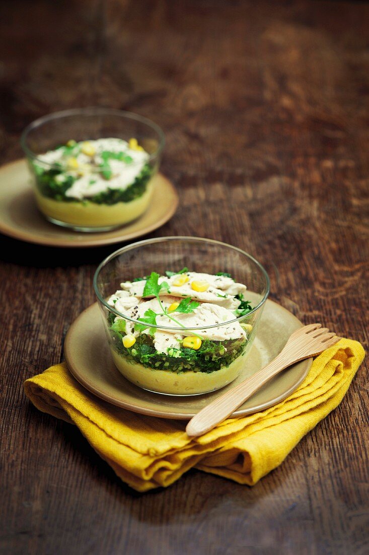 Thinly sliced turkey of a bed of chopped herbs, potato and sweetcorn mash