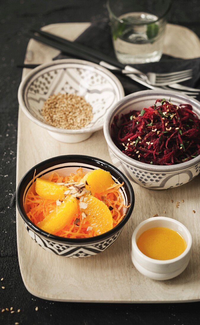 Raw grated beetroot with coriander and grilled sesame seeds, carrot, orange, orange blossom and almond salad