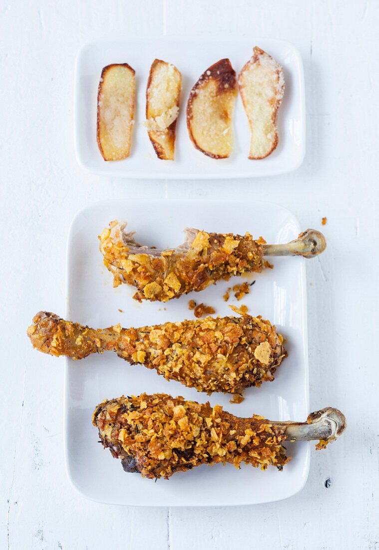 Crispy chicken drumsticks, potato petals with parmesan