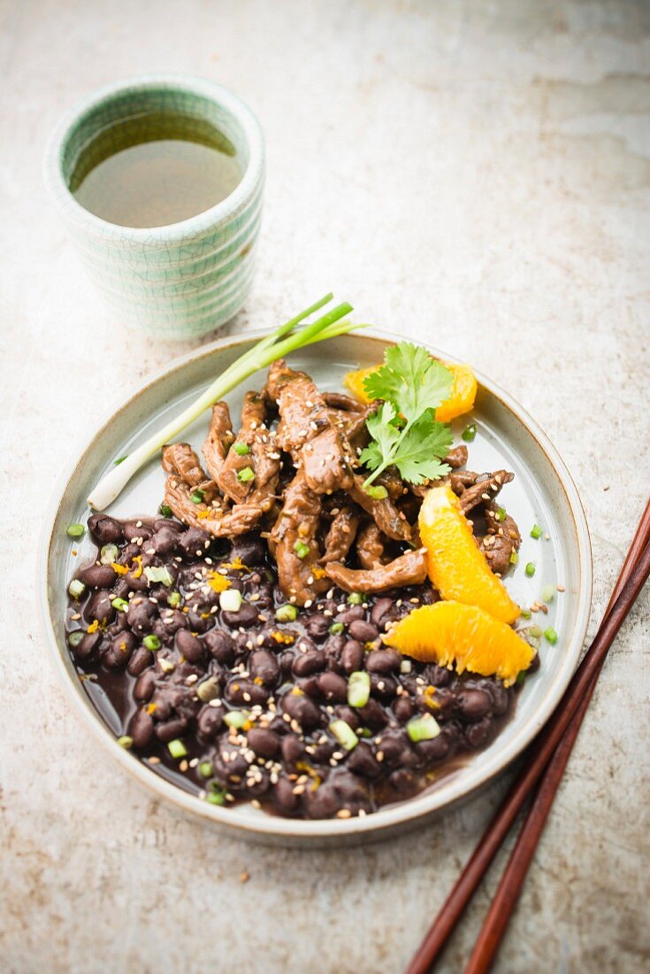 Beef sauté with sesame, black beans and orange