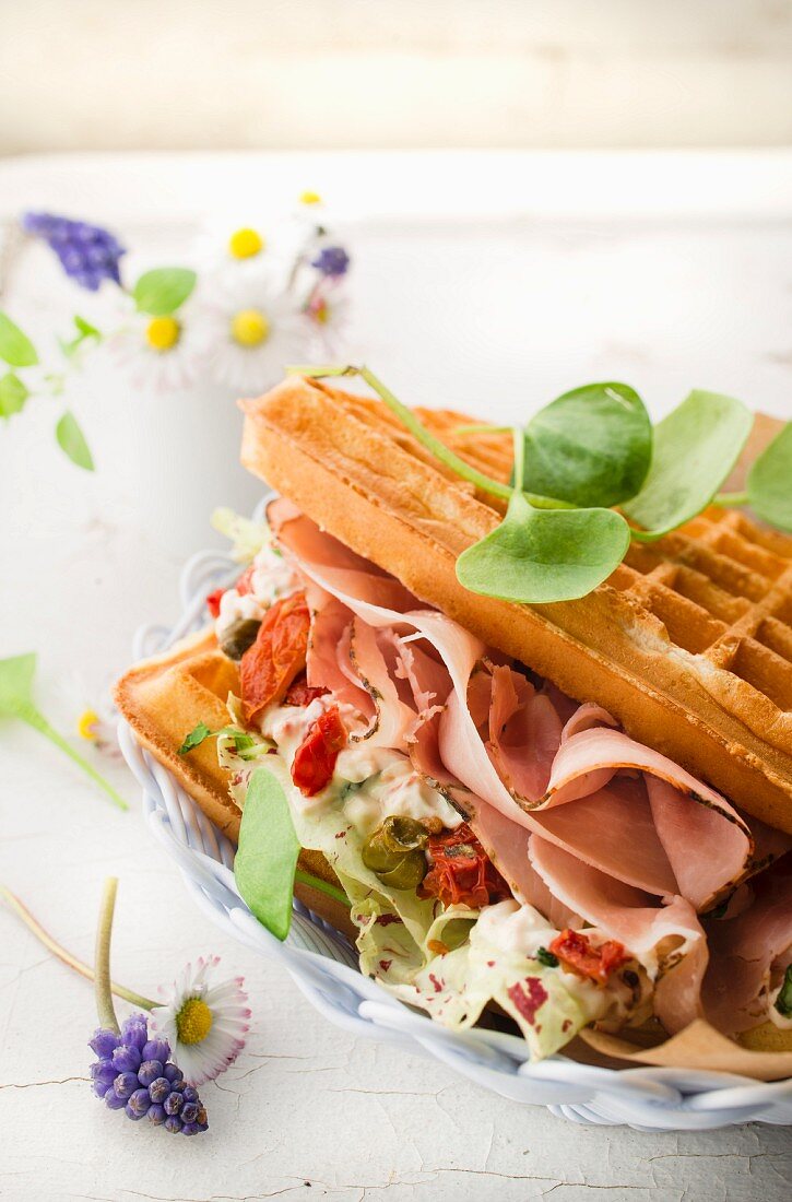 Savoury waffle with ham, tomatoes and cheese