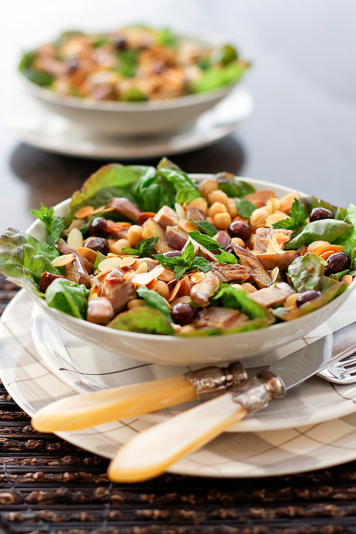 Oriental chickpea, aubergine, olive and thinly sliced almond salad