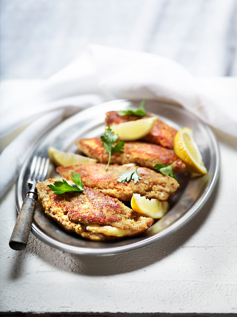 Homemade Munster cheese Cordon-bleu with lemon and parsley