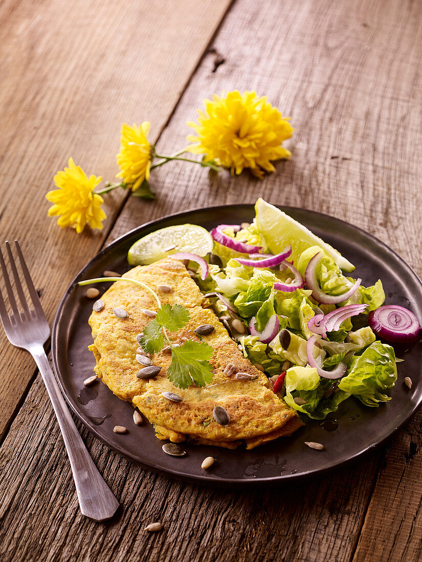 Butternut and chickpea galette with lettuce and red onion seedy salad