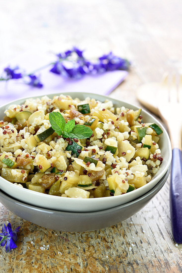 Quinoa,courgettes caramelized in agava syrup, thinly slice almond and mint salad