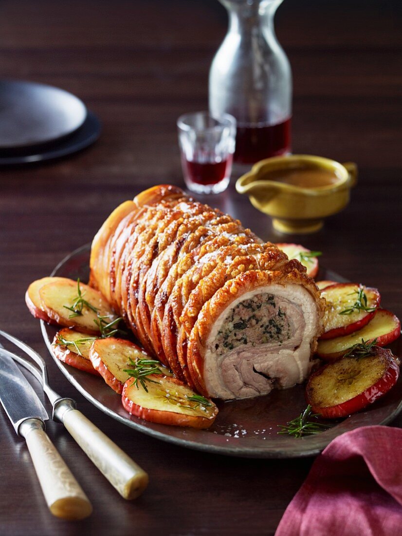 Roasted pork breast stuffed with spinach, breadcrumbs and apples