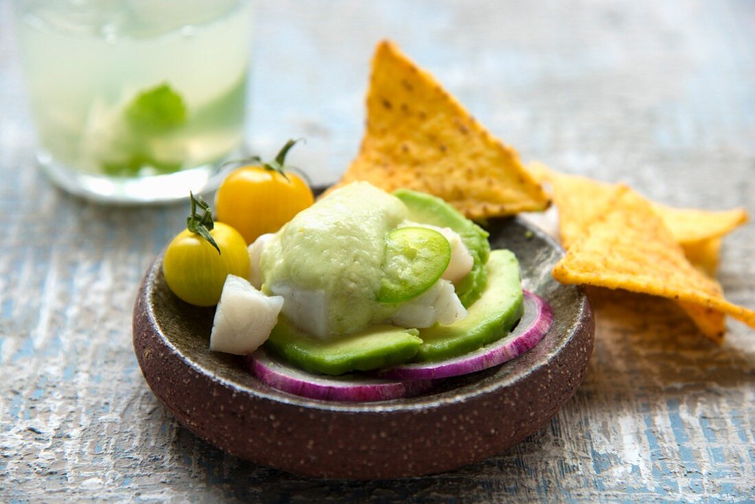 Cod ceviche with mild green pepper emulsion, avocado, striped aubergine and yellow cherry tomatoes, tortillas