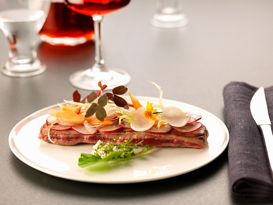 Grilled steak with thinly sliced crisp vegetables