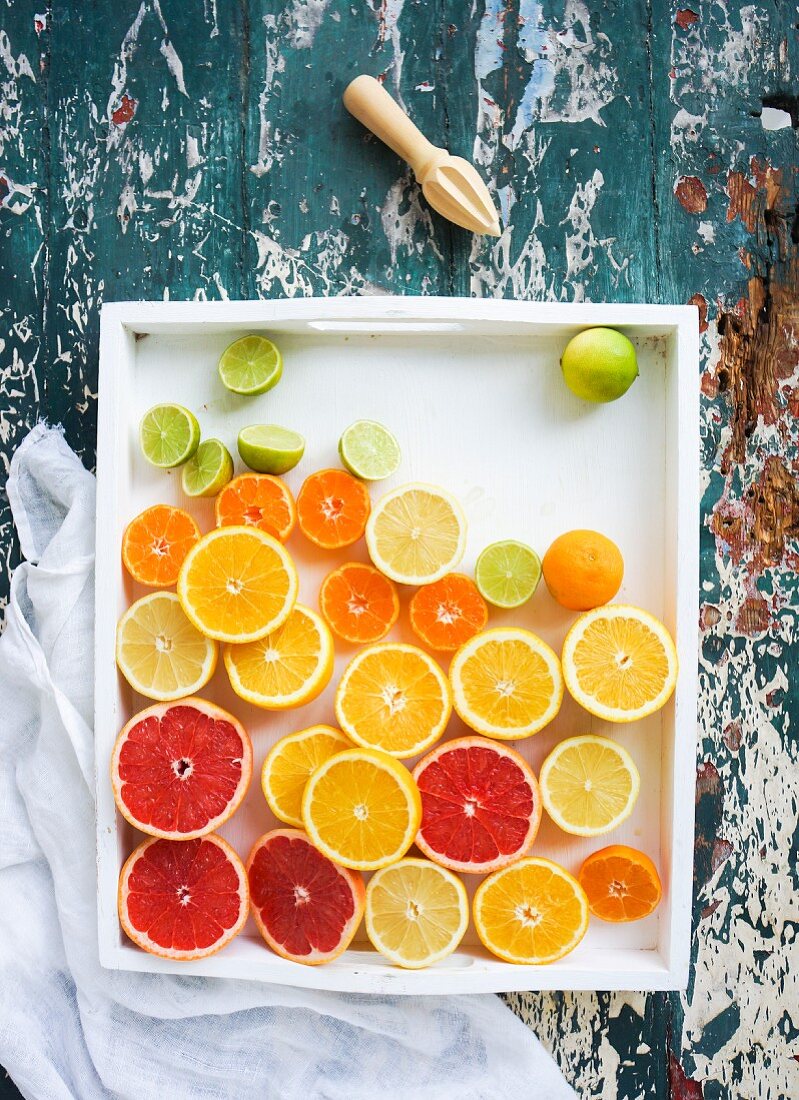 Mixed citrus fruit halves in a dish