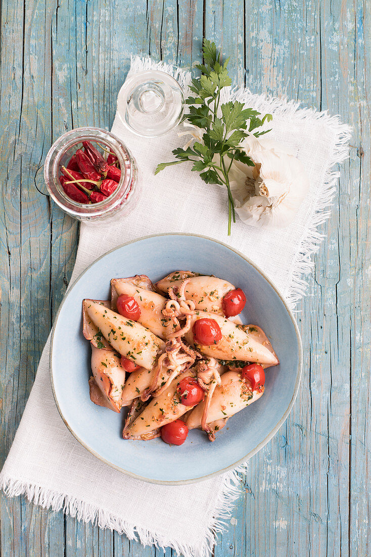 Stuffed squid in chili tomato sauce with garlic and parsley