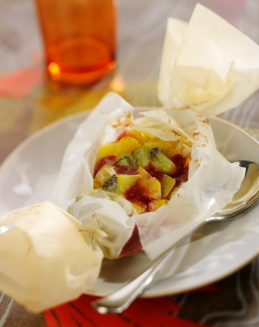 Exotic fruit papillote with strawberry coulis