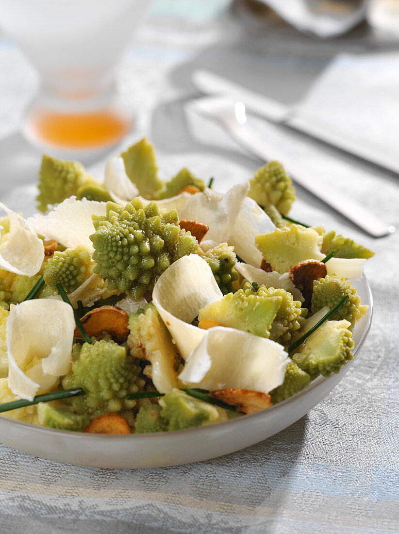 Romanesco cabbage and parmesan salad on a bed of fried garlic