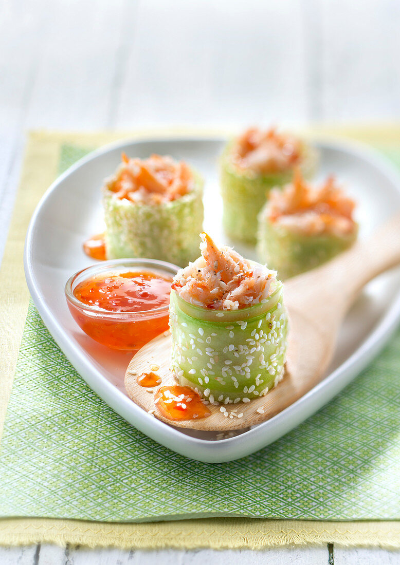 Green apple rolls garnished with crab meat, golden sesame and spicy jelly