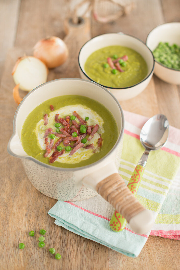 Cream of pea soup with diced bacon