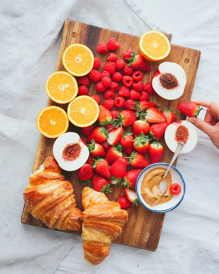 Tray of croissants and fruit