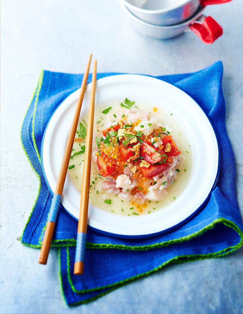 Sea bream tartare with trout roe, tomatoes and fried onions