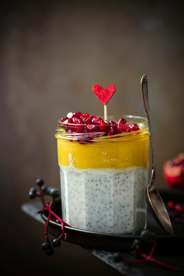 Panacotta chia with mango mousse and pomegranate