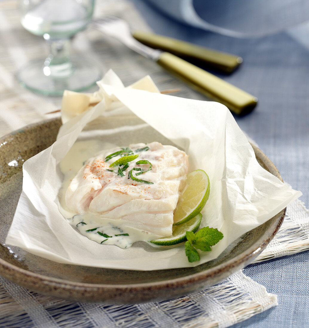 Cod with creamy mint and lime sauce cooked in wax paper