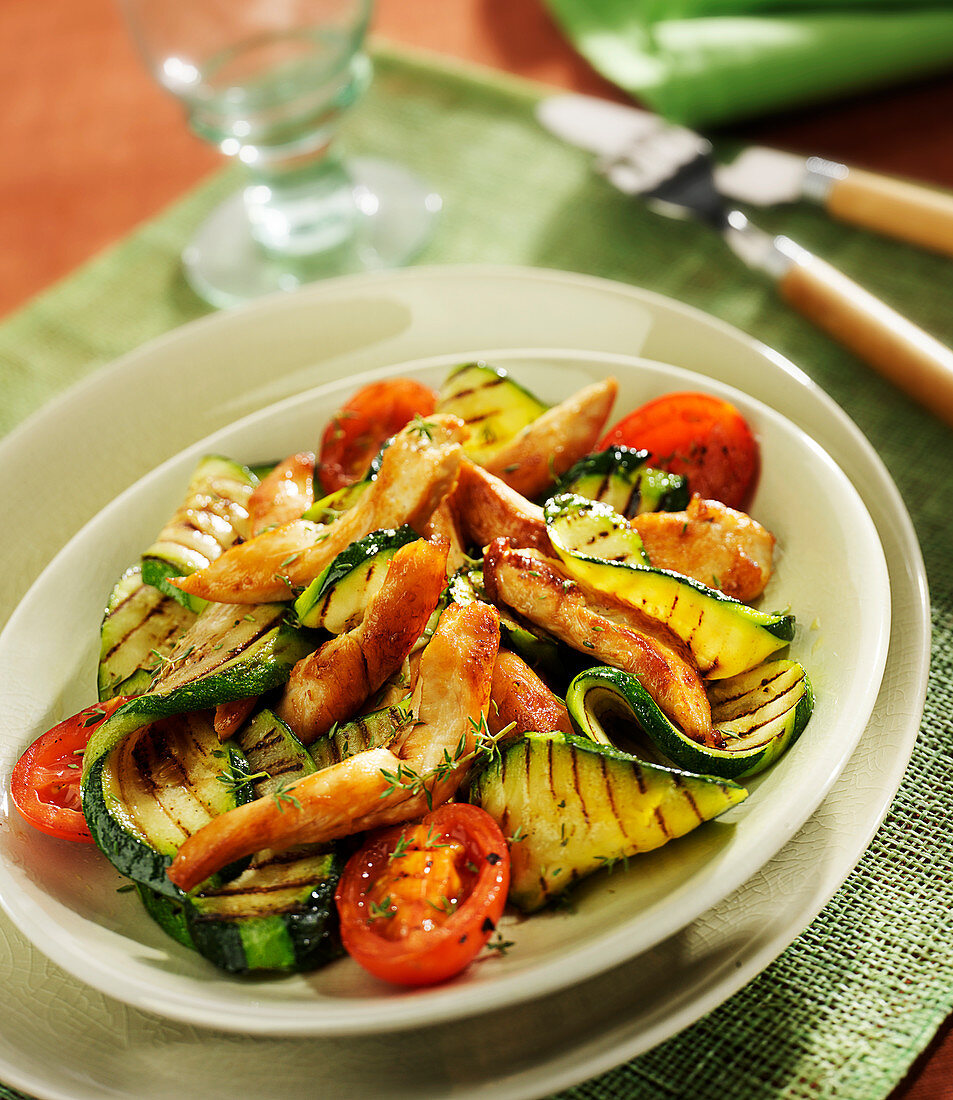 Grilled thinly sliced chicken breast, tomatoes and courgettes