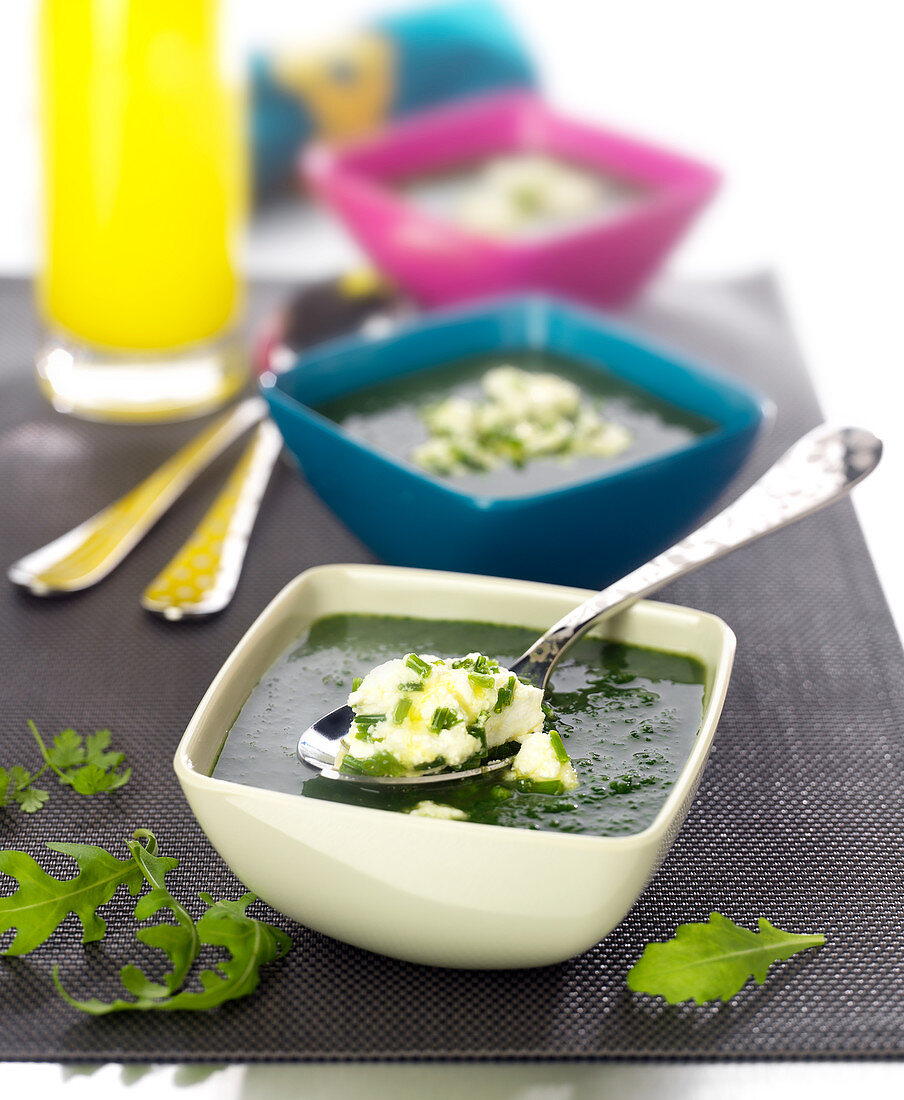 Cream of mixed lettuce soup with goat's cheese and chives