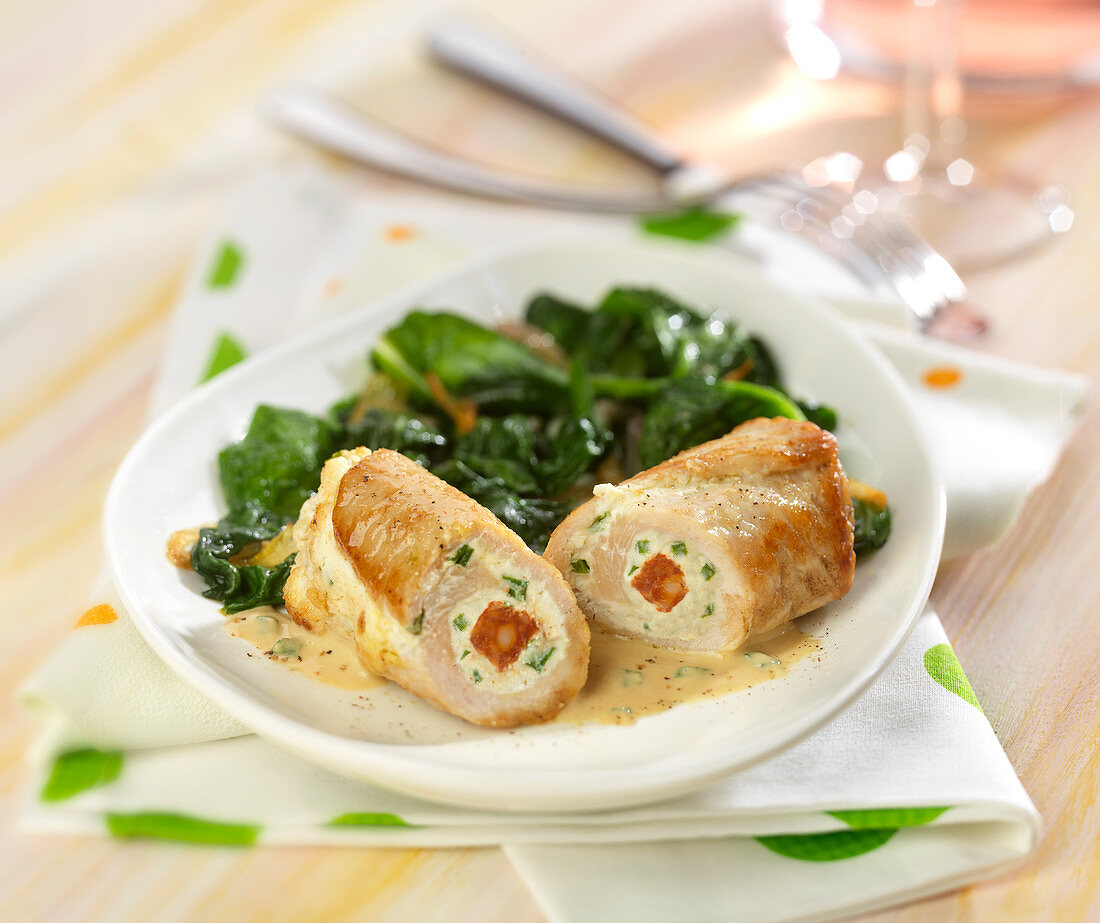 Saltimbocca and stewed spinach leaves