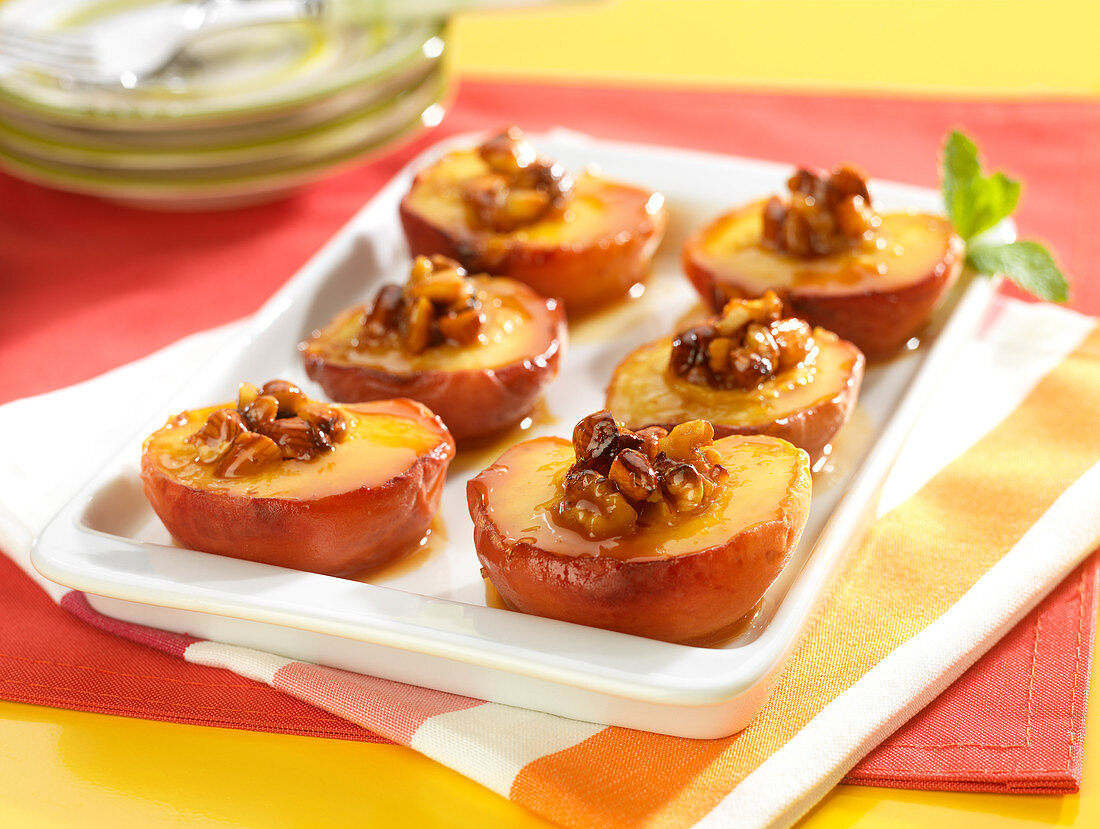 Peach halves roasted with caramelized dried fruit