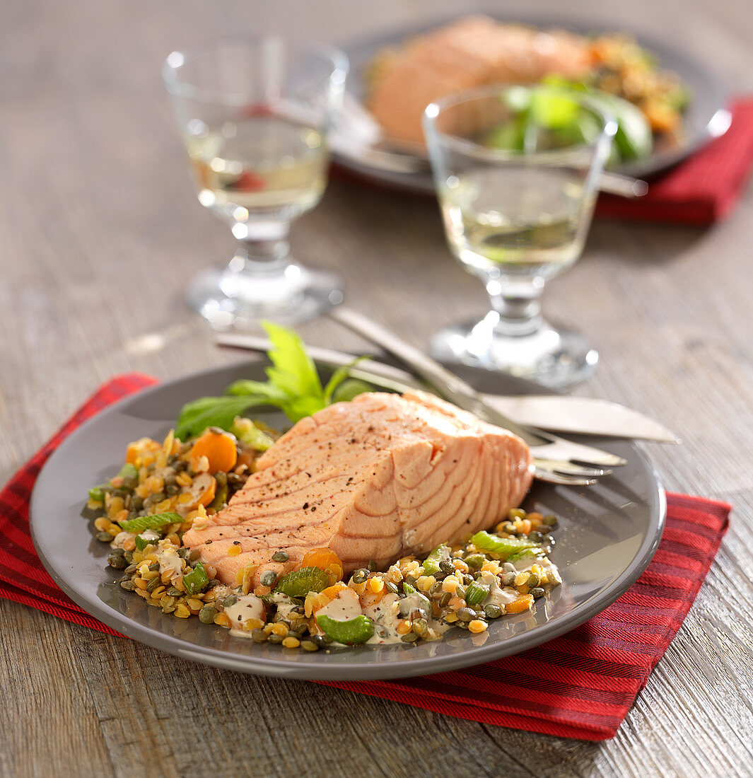 Piece of salmon with two types of lentils