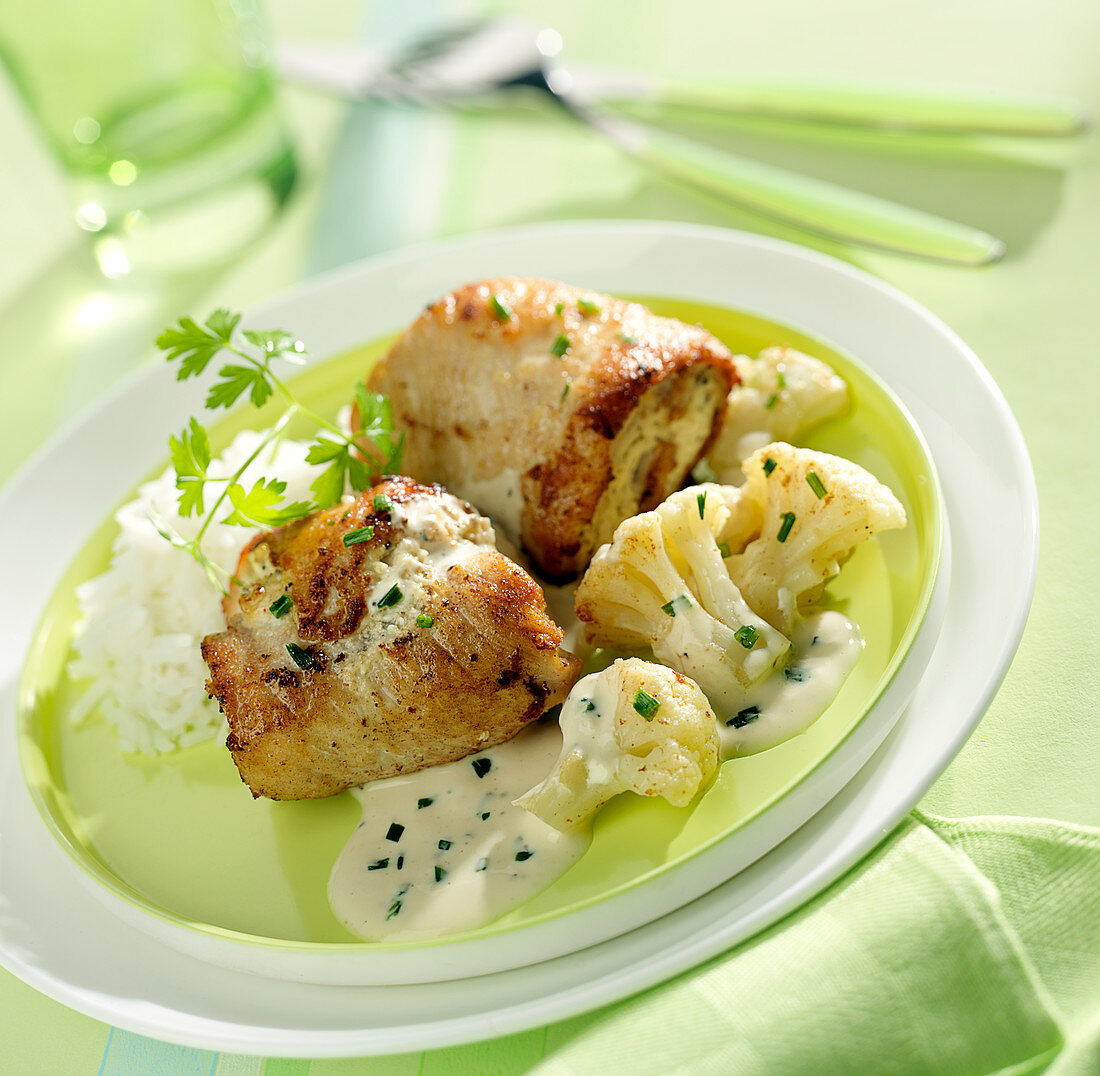 Turkey rolls,cream cheese and chive sauce,cauliflower sauté and rice