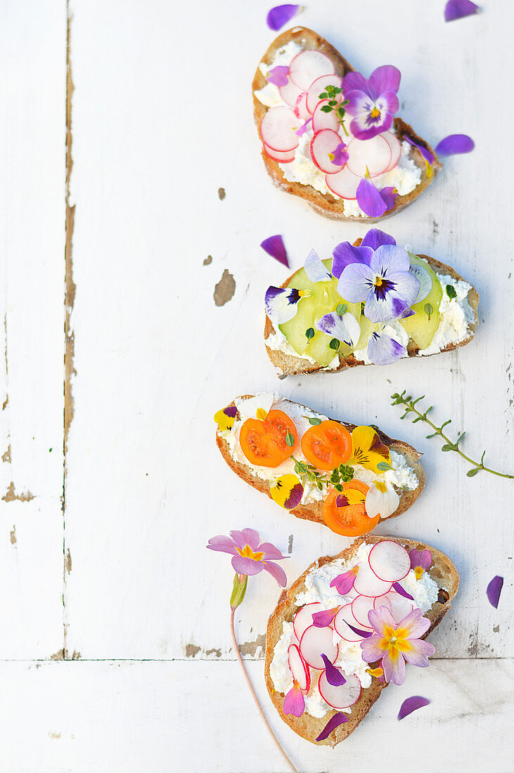 Fromage frais, vegetable and flower open-sandwiches