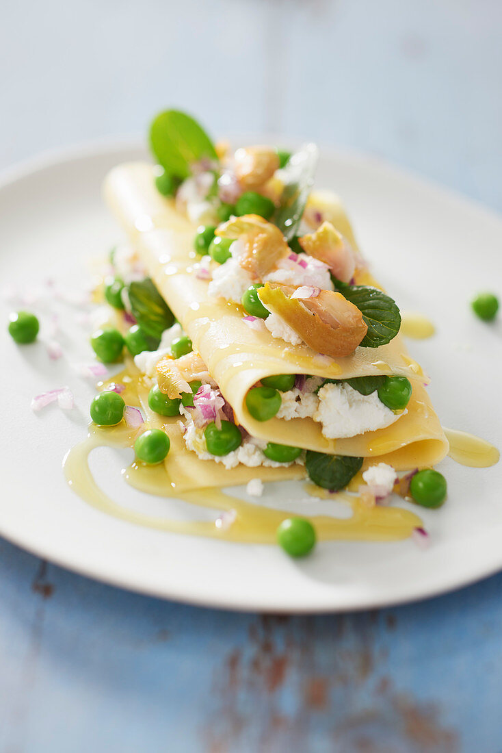 Lasagna with smoked mackerel, fresh goat cheese and peas