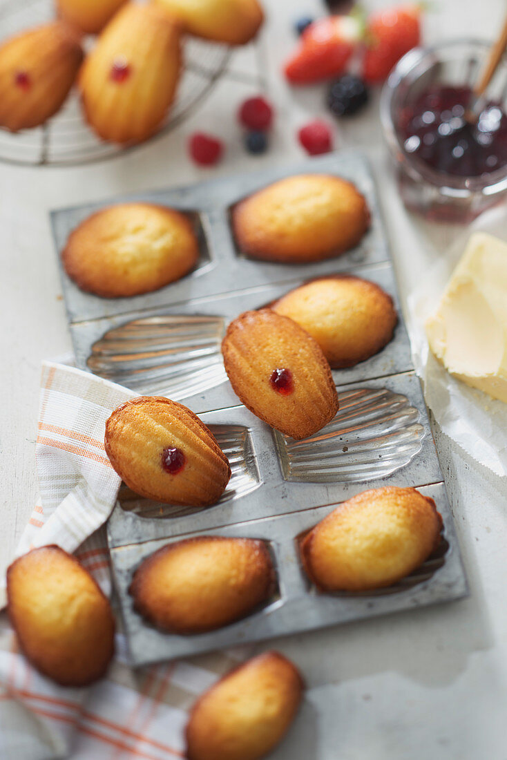 Madeleines filled with red fruit jam