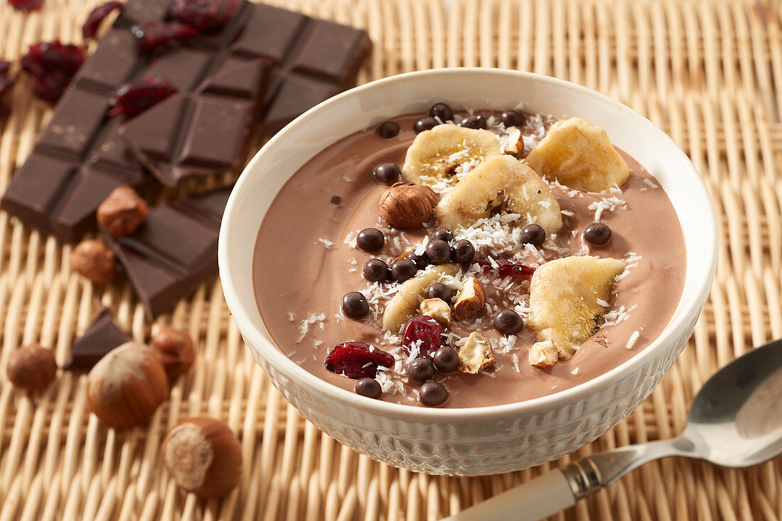 Chocolate, banana, hazelnut and cranberry fruit bowl