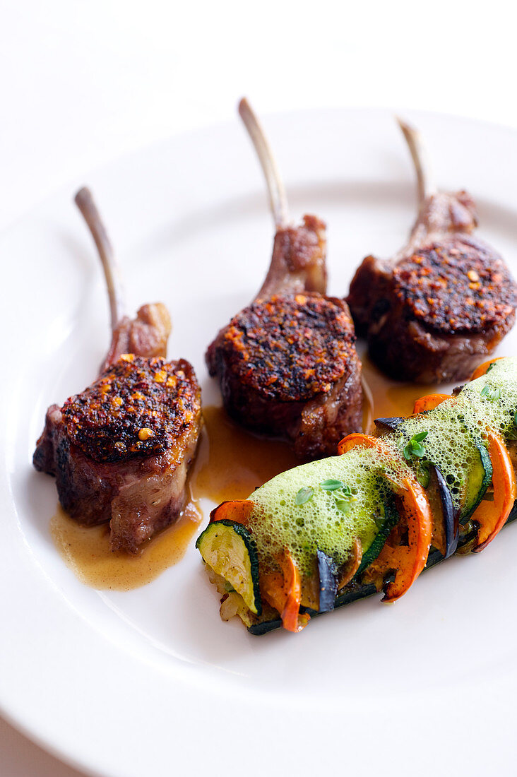 Lamb Chops Coated With Chili Pepper And Confit Tomato,Vegetable Flan Topped With Basil Emulsion
