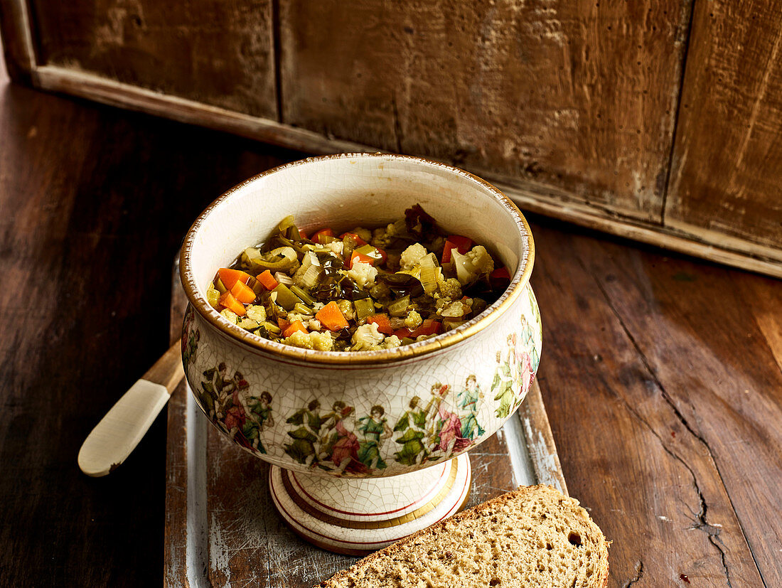 Vegetable soup in an old-fashioned soup bowl