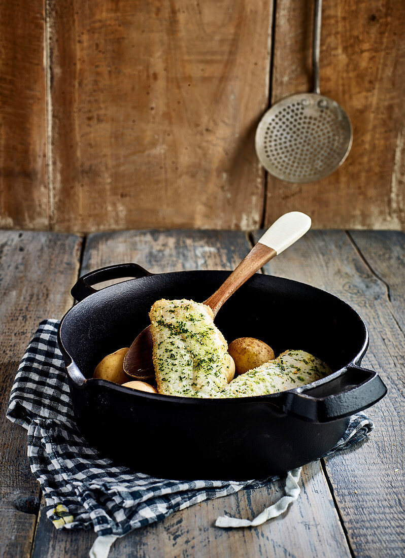 Whiting and potatoes with herb butter sauce