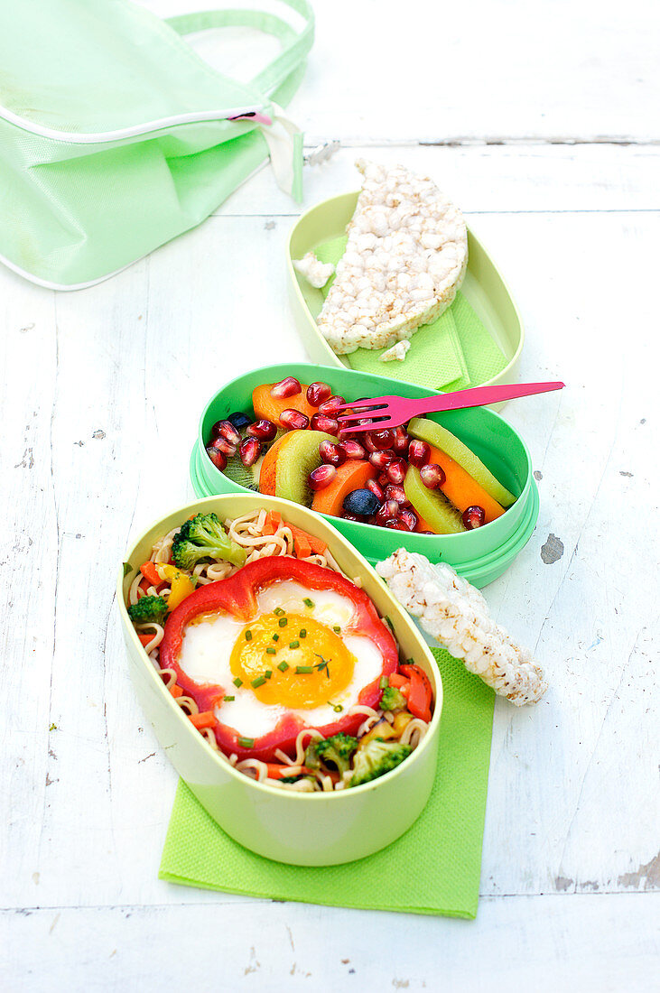 Noodles With Vegetables And An Egg Cooked In Half A Red Pepper Bento And Fruit Salad Bento